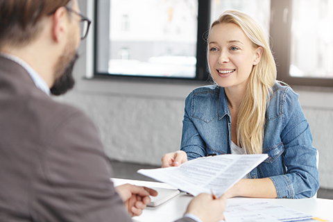 Portrait of successful business people work together with documents, develop common project, discuss enterneurship, meet in coworking process, have productive brainstroming session. Mutual partnership

