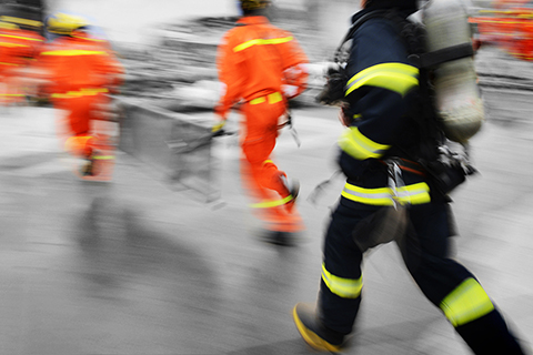 Search,And,Rescue,Forces,Running,To,A,Destroyed,Building.,Blur
